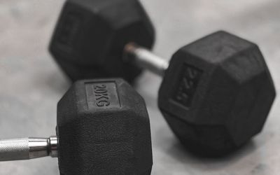 Close up of a heavy metal dumbbell on floor